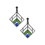 A pair of dangling earrings with a geometric chevron design in blue and green colors, with a hematite finish.