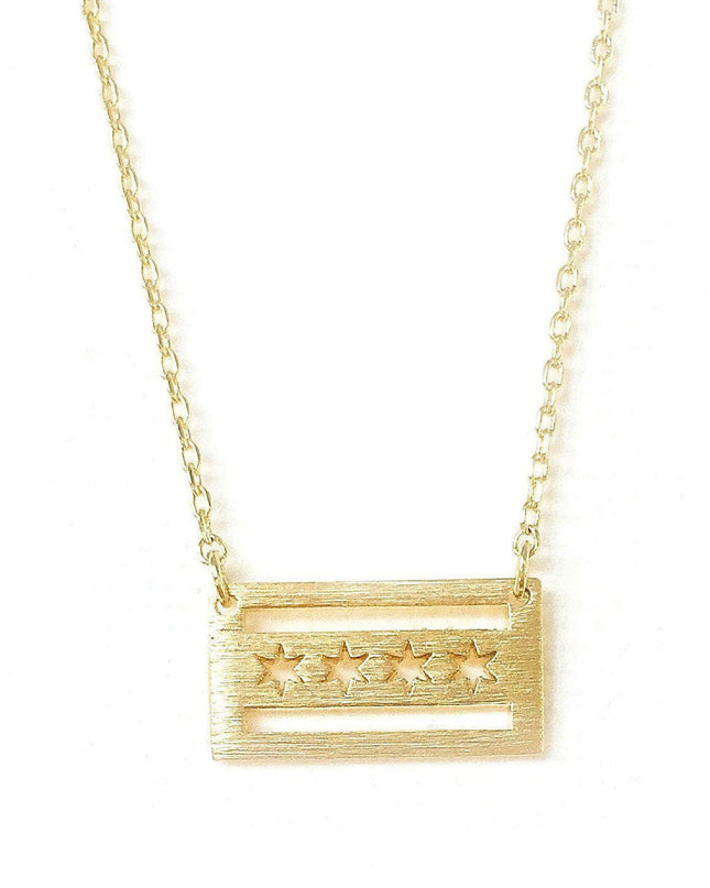 A gold-colored necklace featuring a pendant shaped like the Chicago flag with a brushed texture.