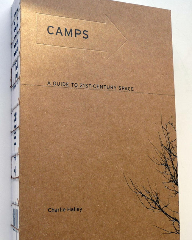 Brown paper cover book with small black text and title Camps.