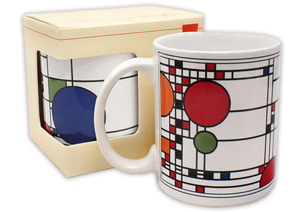 A ceramic mug with a geometric pattern design, adapting the windows of Frank Lloyd Wright's Coonley Playhouse, displayed next to its packaging box.