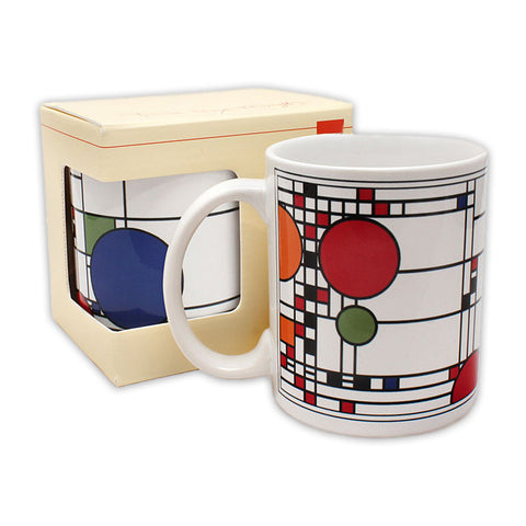 A ceramic mug with a geometric pattern design, adapting the windows of Frank Lloyd Wright's Coonley Playhouse, displayed next to its packaging box.
