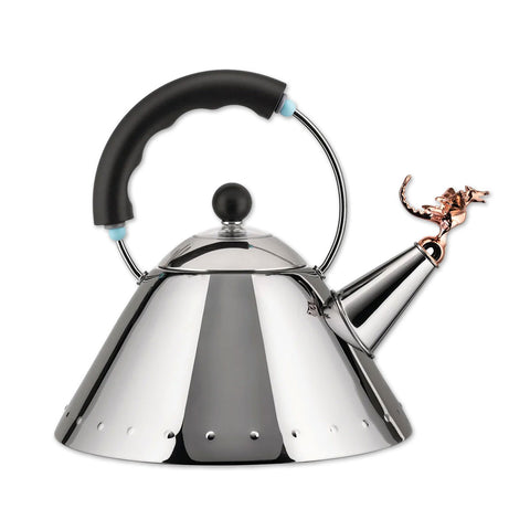 A silver stainless steel tea kettle with a black handle and a copper metallic finish whistle shaped like a t-rex.
