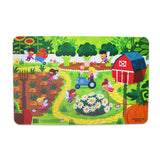 A colorful placemat featuring a garden fairy theme with various cartoon fairies, plants, and a barn in the background.