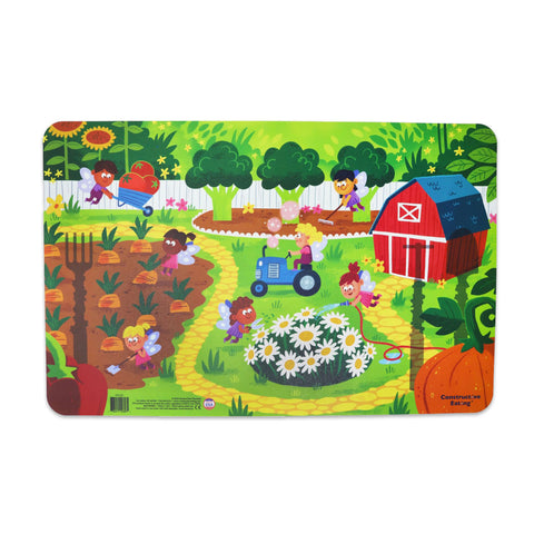 A colorful placemat featuring a garden fairy theme with various cartoon fairies, plants, and a barn in the background.