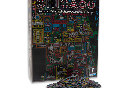 A jigsaw puzzle box with a colorful map of Chicago neighborhoods on it, along with a few scattered pieces.