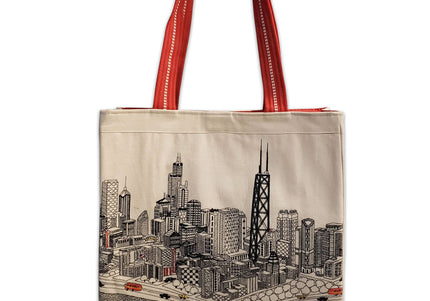 A tote bag with a white fabric featuring a detailed illustration of a city skyline and red ribbed straps.