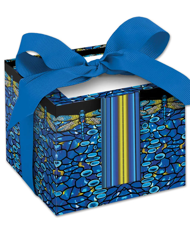A rectangular note cube with a vibrant blue and yellow dragonfly design on a black background, adorned with a blue ribbon.